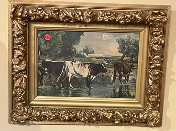 A VICTORIAN CARVED GILTWOOD FRAME WITH COW PRINT