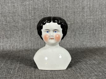 A Hand-Painted Antique Porcelain Doll Head