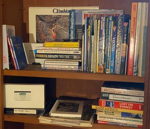 Two Shelves Of Climbing Related Books And VHS Tapes