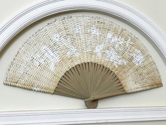 A Large Decorative Woven Reed Fan