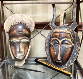 A Pair Of Hand Carved African Masks