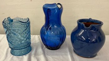 Three Glass And Pottery Pitchers