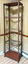 A Vintage Metal Etagere With Glass Shelves