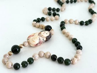 A Netsuke Carving Necklace With Semi Precious Stone Beads