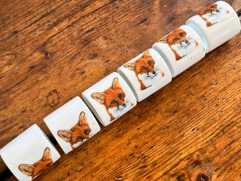 A Set Of Six Ceramic Fox Hunt Themed Napkin Rings