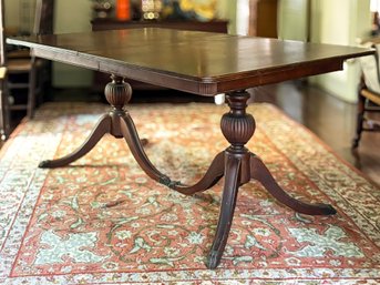 A Vintage Mahogany Pedestal Based Extendable Dining Table