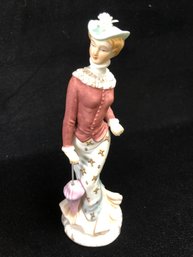 Women In A Red Jacket Figurine