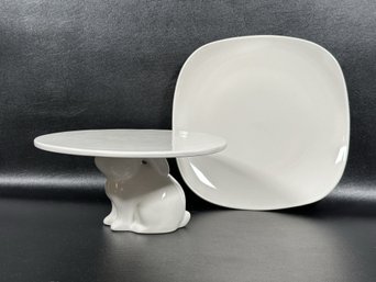 A Pair Of Contemporary White Ceramics: Bunny-Pedestal Cake Plate & Rounded Square Plate