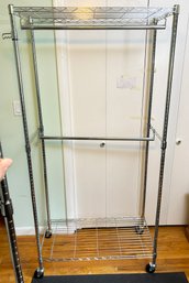 A Hanging Closet Rack - On Wheels For Ease Of Movement - Two Bars