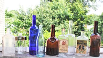 Collection Of Nine Antique Glass Bottles With Old Smoothie Gin, Silver Cliff Rye, Home Brew And More