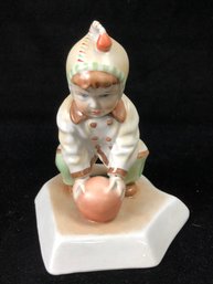 Small Child Playing Ball Figurine