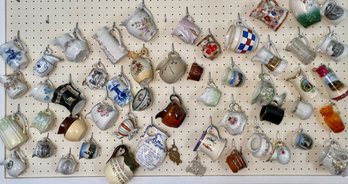 Wall Display Of Pottery, Porcelain And Glass Pitchers (50)