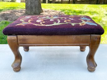 A Needlepoint Covered Footstool