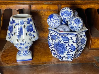 BLUE AND WHITE DECORATIVE PORCELAIN LOT, INCLUDES BALLS, A LANTERN, AND A JARDINIERE