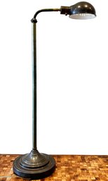 An Adjustable Bronze Floor Lamp By Restoration Hardware