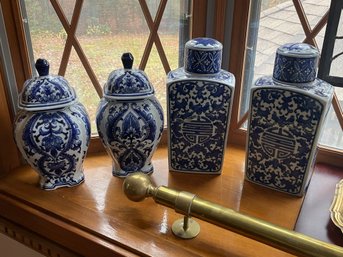 FOUR CHINESE BLUE AND WHITE DECORATIVE COVERED URNS
