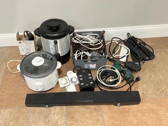 Lot Of Electronics Including Soundbar, Extension Cords, Power Strips, Rice Cooker, And More