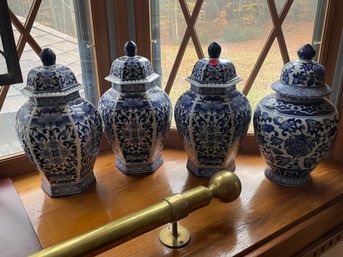 THREE CHINESE BLUE AND WHITE DECORATIVE COVERED URNS