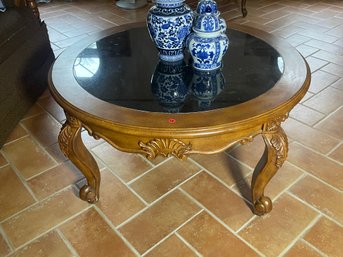 A FRUITWOOD COFFEE TABLE WITH SMOKED GLASS