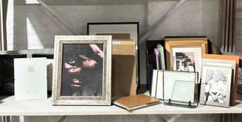 A Large Assortment Of Photo Frames