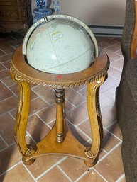 A MIDCENTURY GLOBE ON STAND