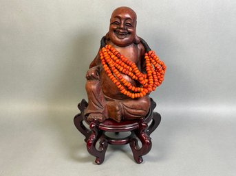 Wood Carved Buddha With Beads On Stand