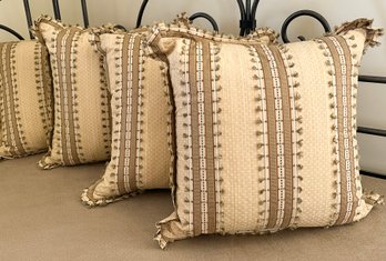 A Set Of Four Luxe Throw Pillows