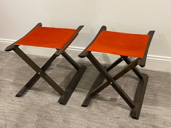 A Pair Of Nomadic Style Folding Stools With Kyle Bunting Cow Hide Sling Seat And Solid Wood Frame