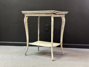 A Vintage Two-Tier Table With An Intentionally-Distressed Finish