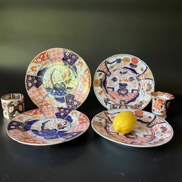 A Collection Of Four Imari Plates And Two Cigarette Holders