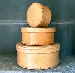 A Set Of Three Adorable Leather Clad Nesting Cases