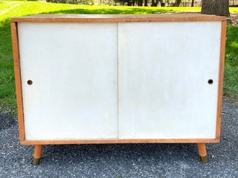 A Vintage Mid Century Sliding Door Cabinet