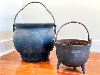 A Pairing Of Antique Cast Iron Bean Pots