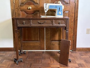 A Vintage Singer Sewing Machine In Table