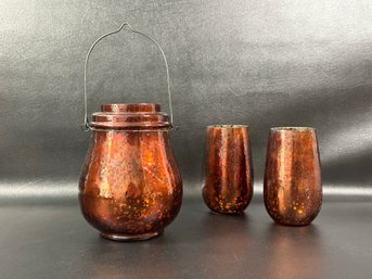 A Set Of Coppery Mercury Glass Candle Holders