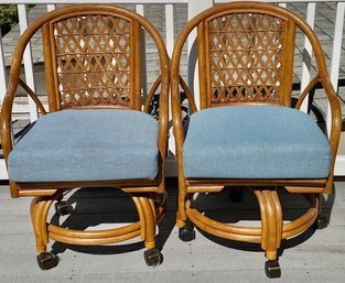 Pair Of Rattan Swivel Chairs On Casters (2)