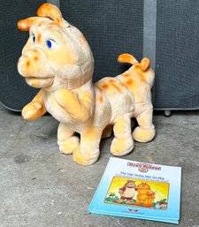 A Teddy Ruxpin Stuffed Animal And Book