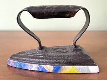 An Antique Cast Iron Iron