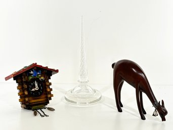A Crystal Ring Holder, Miniature Cuckoo Clock, And Deer Figurine