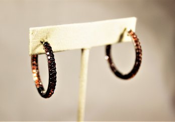 Fine Sterling Silver Round Hoop Pierced Earrings Having Garnet Stones