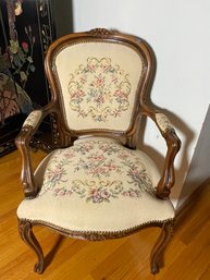 A CARVED WOOD FRENCH FAUTEIL CHAIR WITH NEEDLEPOINT UPHOLSTERY
