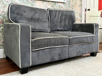 A Corduroy Loveseat With Storage Beneath