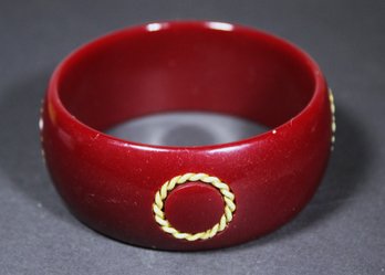Vintage Burgundy Red Bakelite Bangle Bracelet Having Gold Tone Wreath Embellishment
