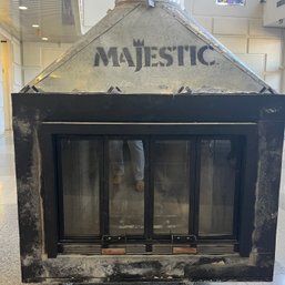 A Fireplace Box Insert With Glass Doors - Majestic