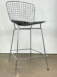 A Bertoia Counter Stool With Leather Seat