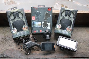 Mixed Electronics Lot With A Pair Of Duro Dash Video Camcorder's, TomTom GPS, Wireless Sport Earbuds, Etc.