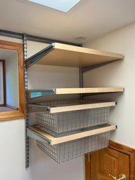 An Elfa Wall Mounted Shelf And Drawer Storage System - Basement