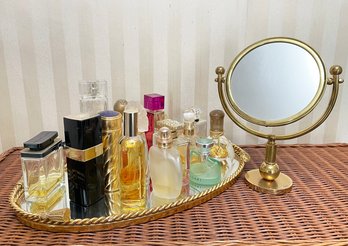 A Gold Vanity Set And A Collection Of Ladies Perfume