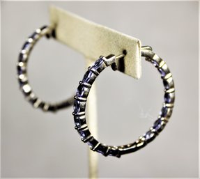 Fine Sterling Silver Hoop Earrings Having Tanzanite Stones