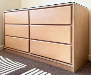 A Modern Bent Ply Dresser In Blonde Finish With Custom Glass Top, Possibly Arhaus